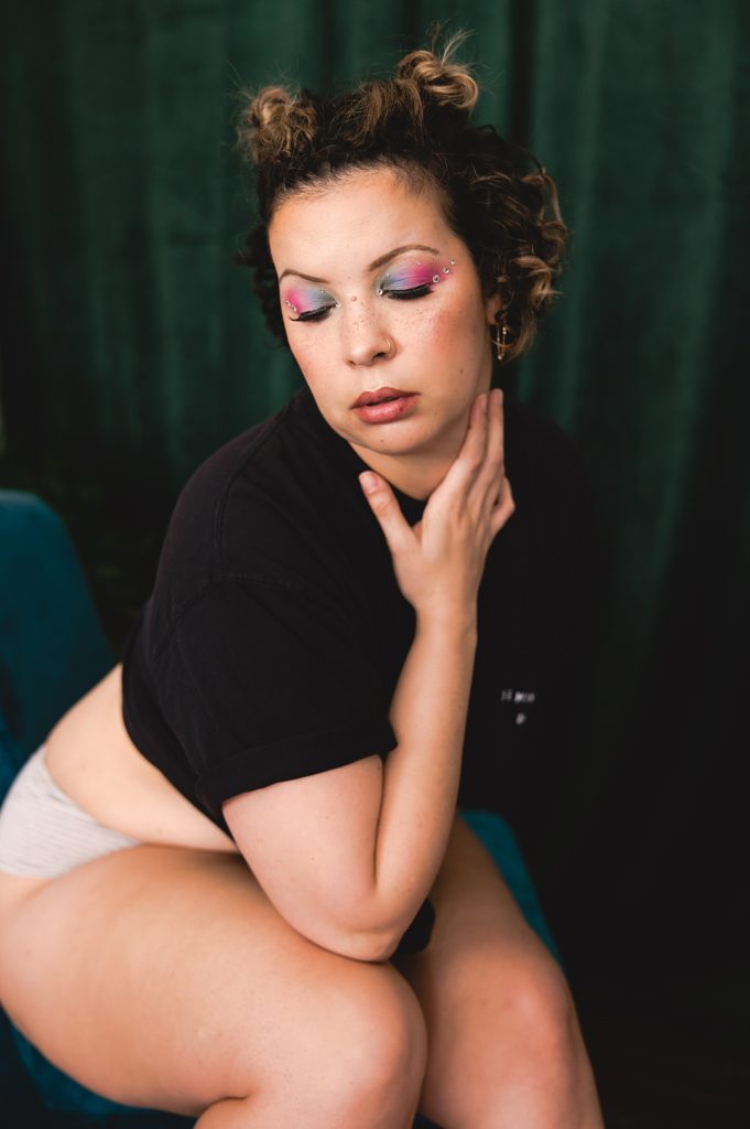 Woman with colorful makeup and black tee shirt for Euphoria inspired sexy shoot. 