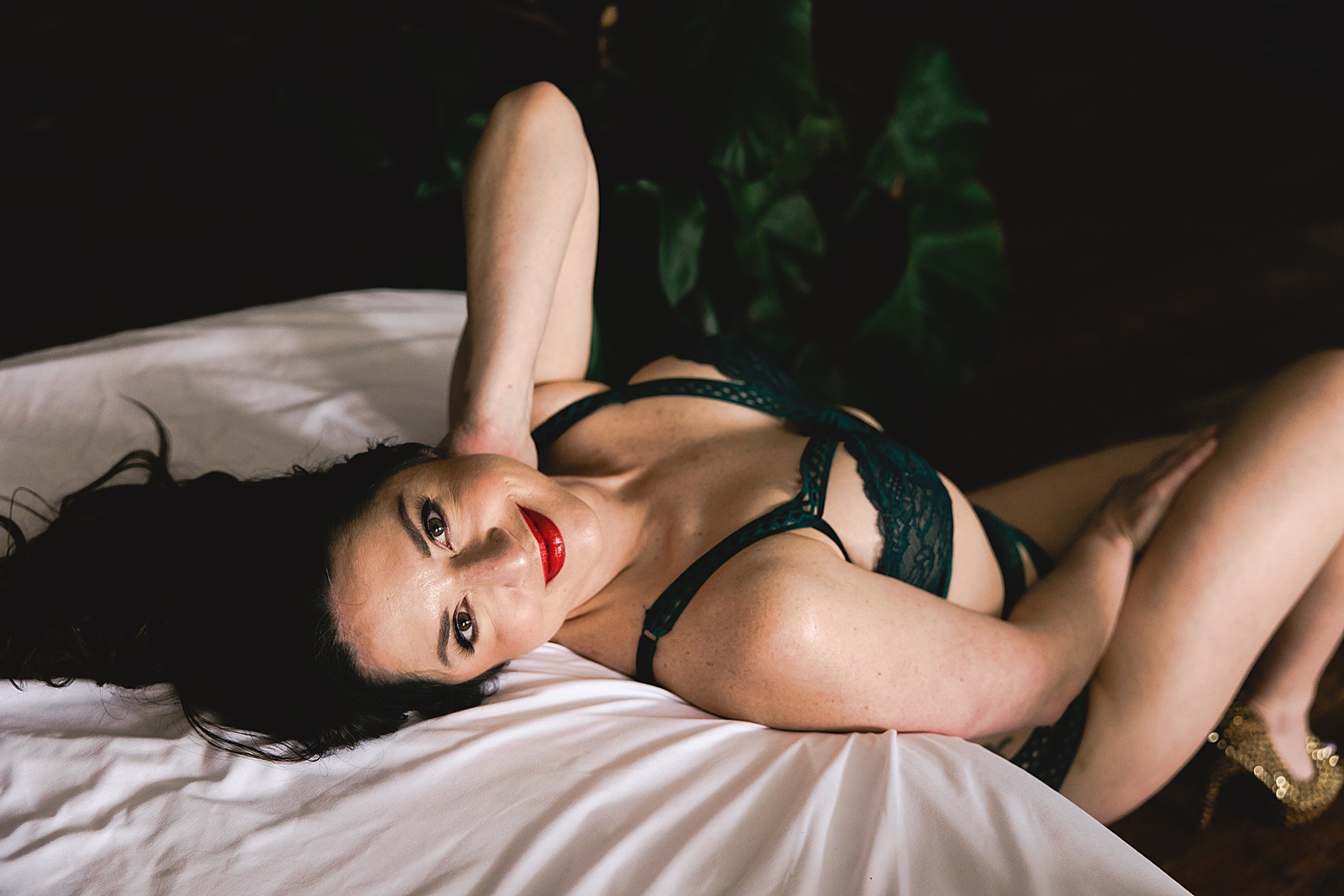 Woman in green lingerie for sensual shoot with WMNKND studios in Kansas City