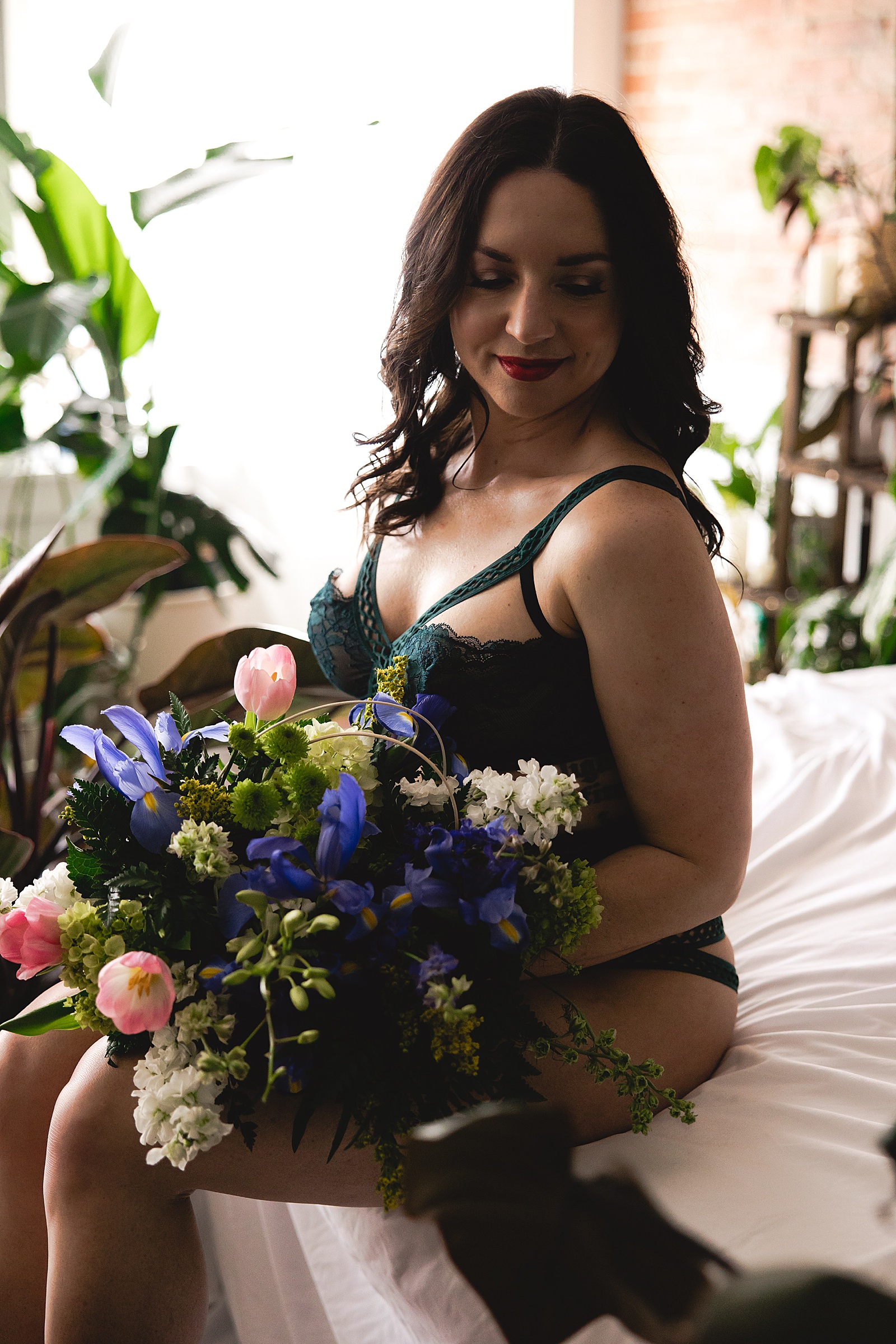 Woman in lingerie with a flowers for her empowering floral session