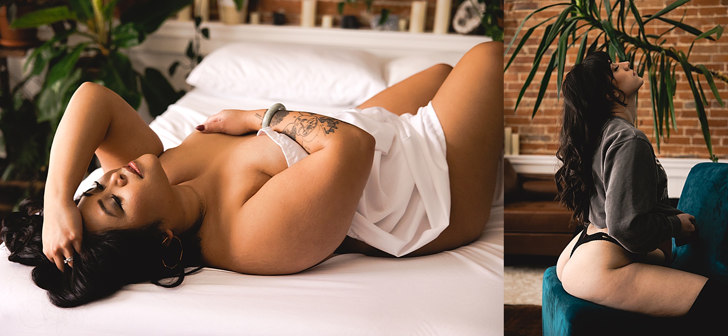 woman wearing crew neck sweatshirt and laying on bed with white sheeting during boudoir session 