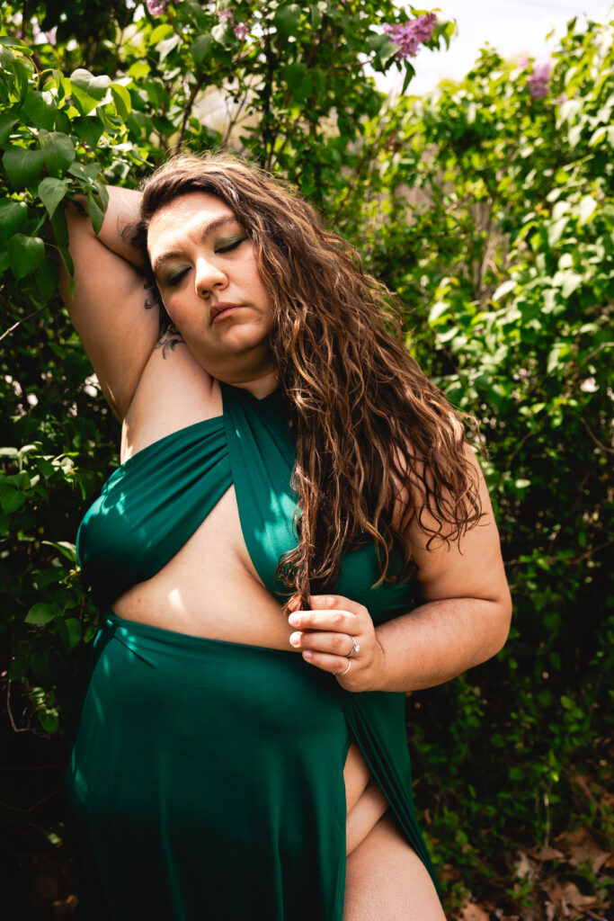wmnknd empowerment photography client resting with eyes closed, reclaiming her body story and softness