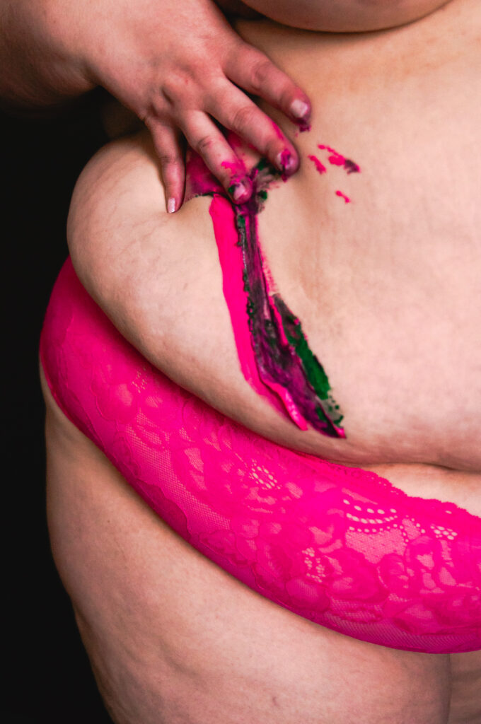 Client embracing her body during a sacred self-image shoot