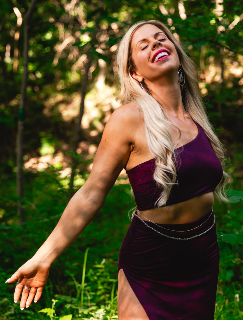Woman dancing joyfully outside during kansas city body empowerment session